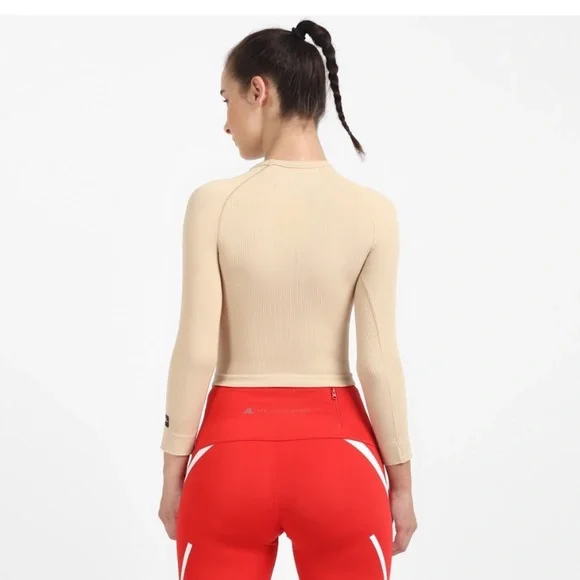 ADIDAS
Women Solid Round Neck Beige T-Shirt - Picture 2 of 9